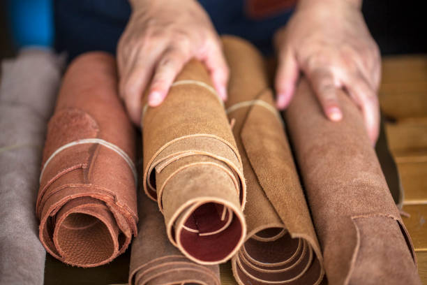 hand choosing leather materials stock photo