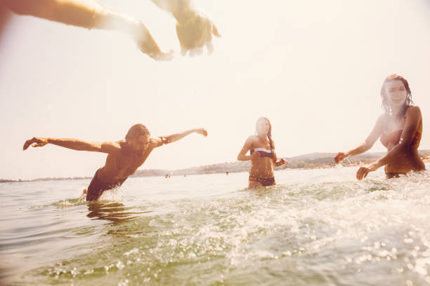 istock Friends having fun in the sea 686171234