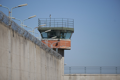 Prison wall with security systems