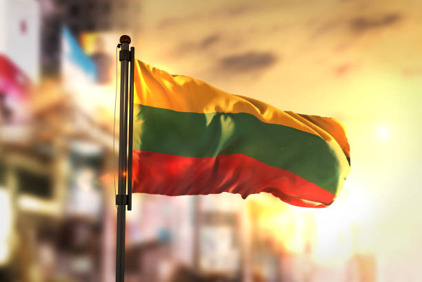 istock Lithuania Flag Against City Blurred Background At Sunrise Backlight 686175294
