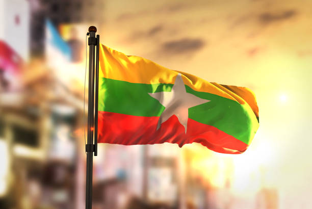 istock Myanmar Flag Against City Blurred Background At Sunrise Backlight 686178298