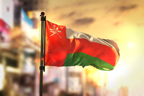 istock Oman Flag Against City Blurred Background At Sunrise Backlight 686178624