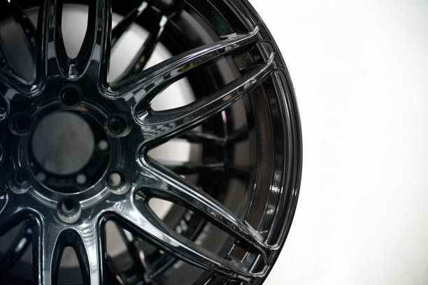 Closeup silver alloy wheel on black background