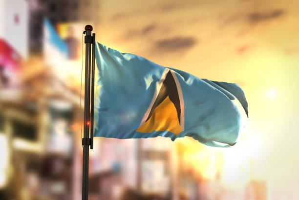 istock Saint Lucia Flag Against City Blurred Background At Sunrise Backlight 686179304