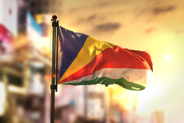 istock Seychelles Flag Against City Blurred Background At Sunrise Backlight 686181646