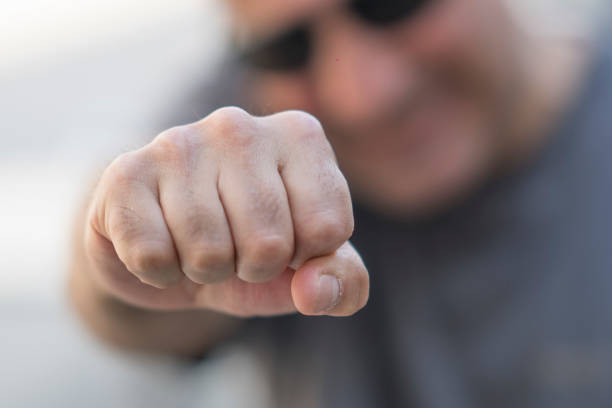 istock Man making clenched fist at camera. Selective focus 686184370