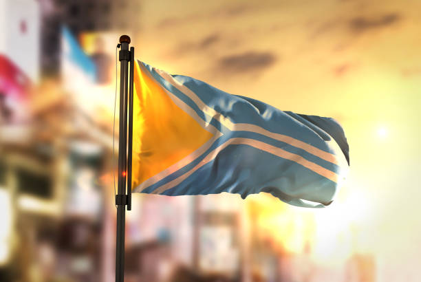 istock Tuva Flag Against City Blurred Background At Sunrise Backlight 686185136