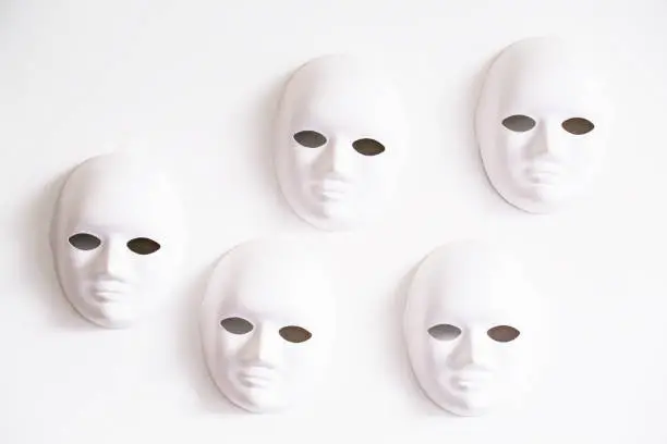 masks hanging on white wall
