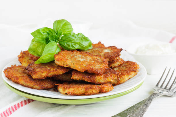 istock Plate of potato pancakes with basil leaves 686187898