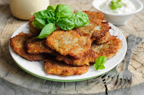 istock Potato pancakes and sour cream in plate 686189398