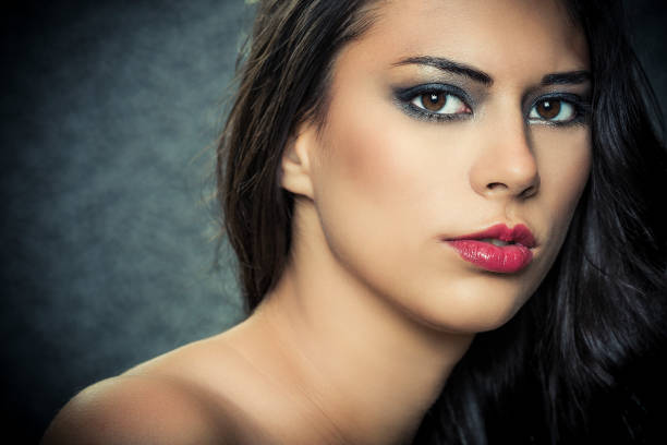Portrait of beautiful glamourous woman. About 20 years old, Caucasian brunette.