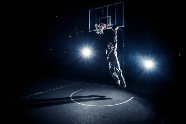 Photo of Young man playing basketball