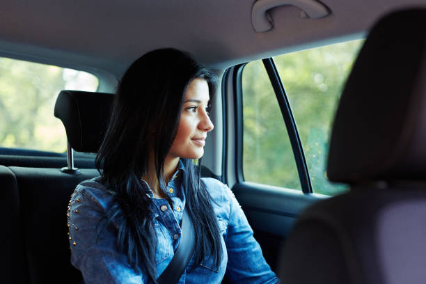 istock Woman in a car looking out the window 686199260