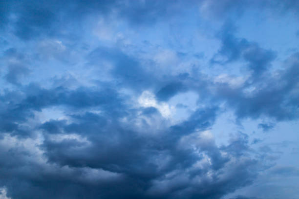 Beautiful clouds at sunset after rain as background