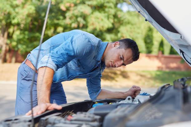 istock Man standing in front of a broken car 686202056