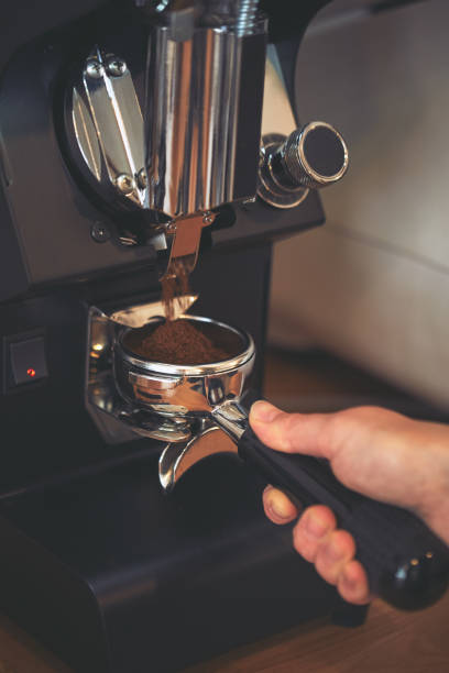 istock Coffee grinder grinds freshly coffee beans 686211912