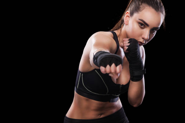 istock Sportsman muay thai boxer fighting. Isolated on black background. Copy Space. 686212326