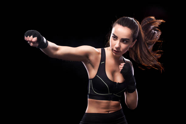 istock Sportsman muay thai boxer fighting. Isolated on black background. Copy Space. 686212476
