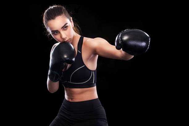 istock Sportsman muay thai boxer fighting. Isolated on black background. Copy Space. 686214672
