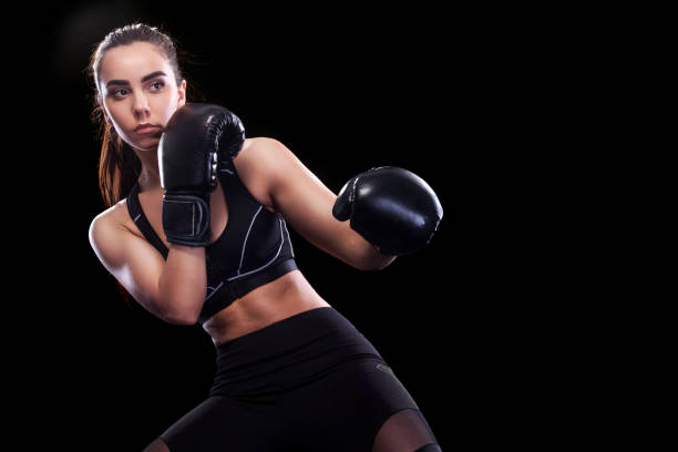 istock Sportsman muay thai boxer fighting. Isolated on black background. Copy Space. 686214714