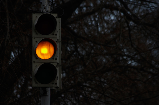 Traffic signal, yellow light at night