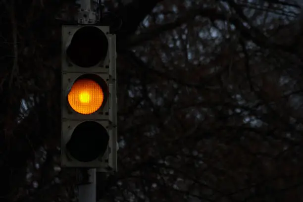 Photo of Traffic signal, yellow light at night