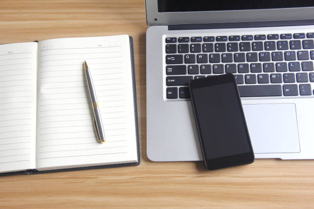 istock Laptop, notebook and phone on the desk 686228450