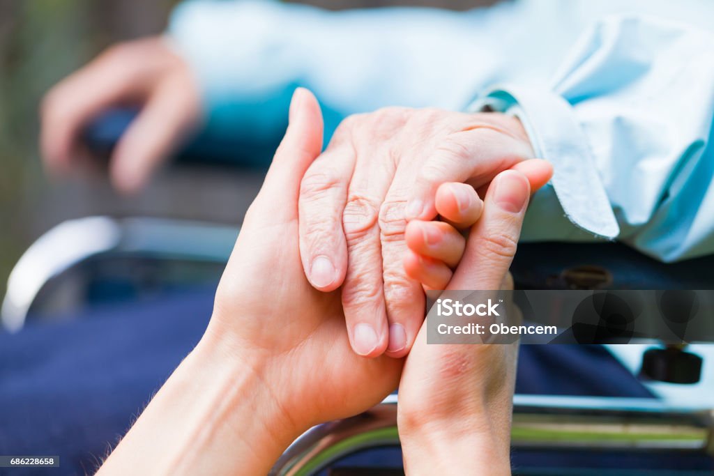 Helping hands Young carer giving helping hands for the elderly woman Senior Adult Stock Photo