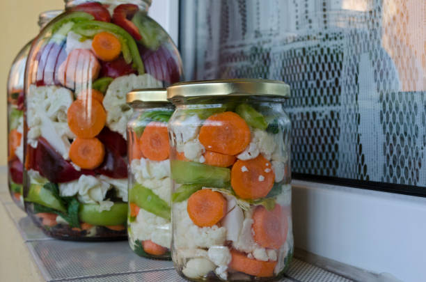 Pickled organic vegetables in glass jars