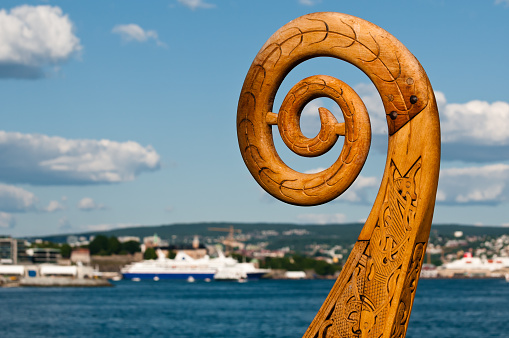 The bow of a Viking boat with a wood carving