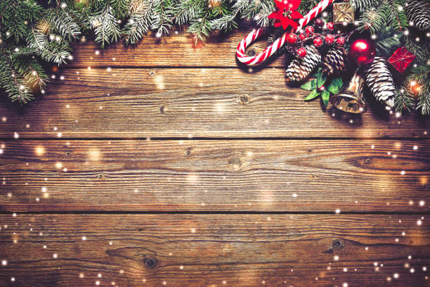 Christmas background with fir tree and decoration Christmas background with fir tree and decoration on dark wooden board fir tree photos stock pictures, royalty-free photos & images