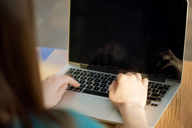 istock Hands typing on laptop keyboard at the cafe 686235094