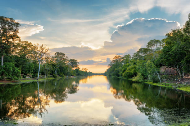 istock Sunset over ancient moat surrounding mysterious ruins of Angkor Thom 686237572