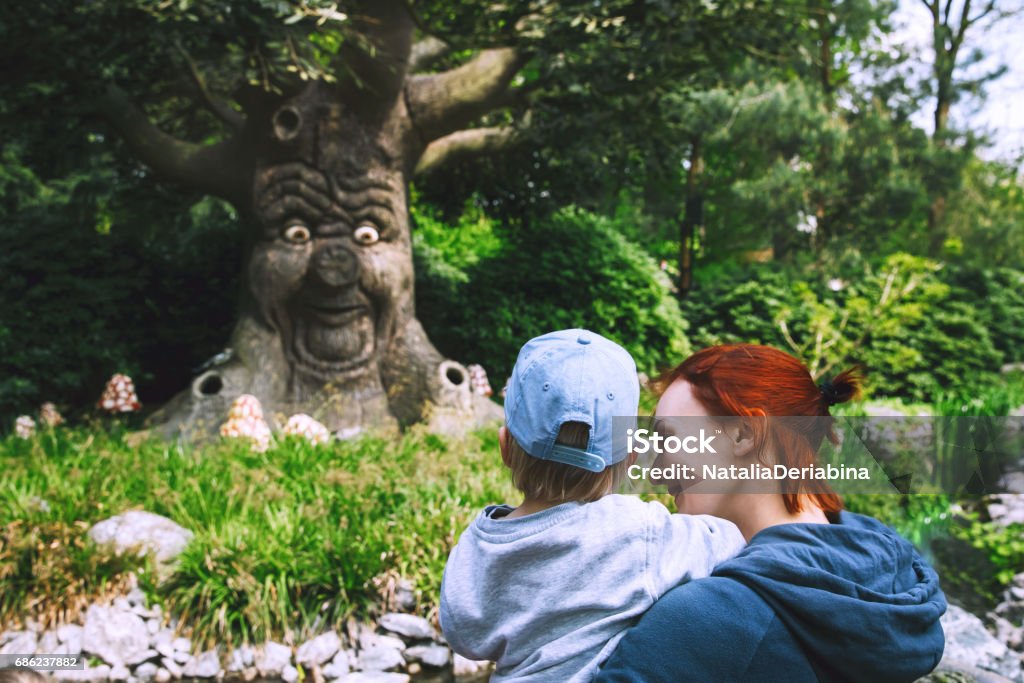 Fantasy themed amusement park Efteling in Kaatsheuvel, Holland, Netherlands, Europe. Family is having fun at amusement park. Fantasy themed amusement park Efteling in Kaatsheuvel, Holland, Netherlands, Europe. Attractions are based on elements from ancient myths, legends, fairy tales. Amusement Park Stock Photo