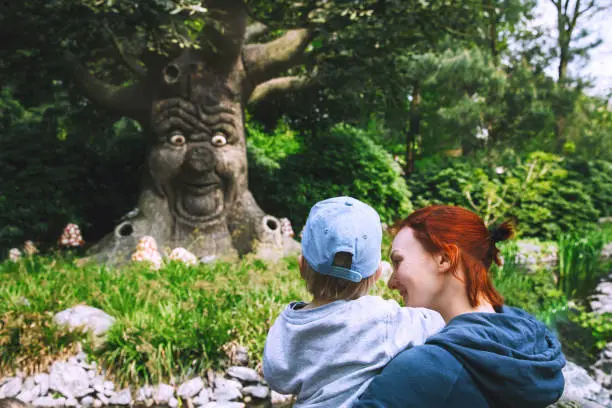 Family is having fun at amusement park. Fantasy themed amusement park Efteling in Kaatsheuvel, Holland, Netherlands, Europe. Attractions are based on elements from ancient myths, legends, fairy tales.