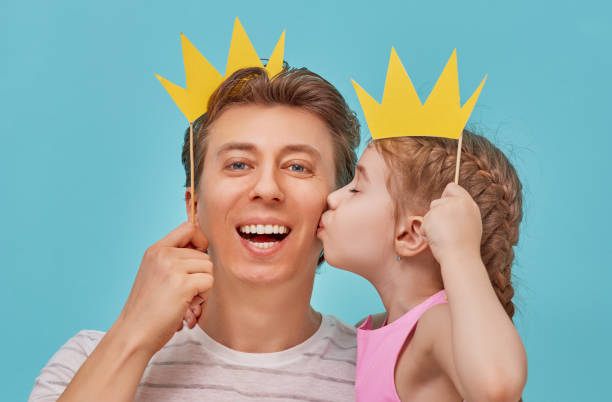 istock Dad and child are holding paper crown 686250948