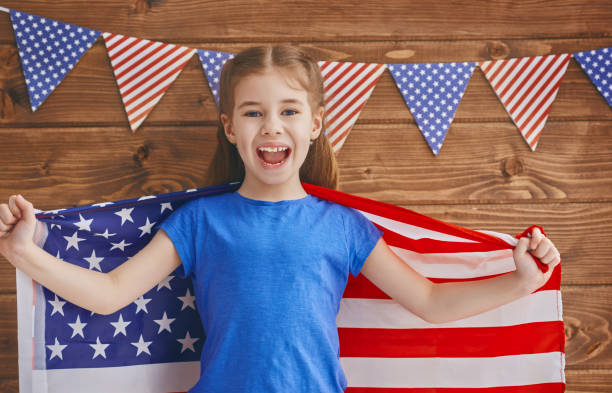 istock girl with American flag 686254688