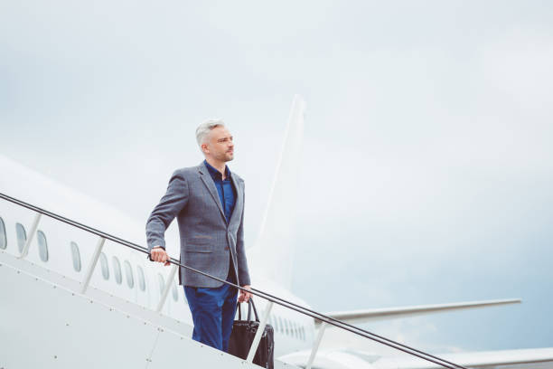 istock Mature businessman disembarking the airplane 686261280