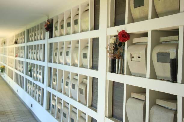 Urns with ashes in a columbarium wall