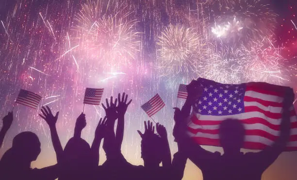 Photo of people holding the Flag of USA