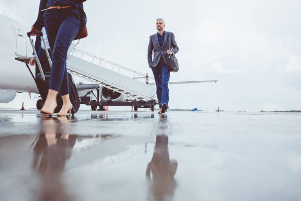istock People leaving airplane after landing 686264524