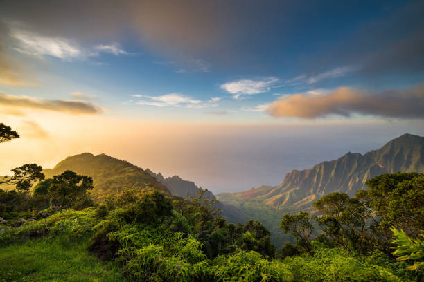 Sunset over Kalalau Valley Hawaii Islands, Island Sunset, Sea, Tropical Climate pacific islands photos stock pictures, royalty-free photos & images
