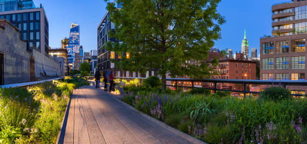 highline panoramic view at twilight with city lights. chelsea, new york city - chelsea new york imagens e fotografias de stock