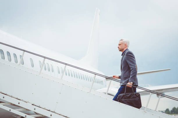 istock Mature businessman boarding airplane 686268496