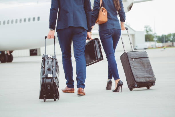 istock Business colleagues walking towards the airplane 686273518