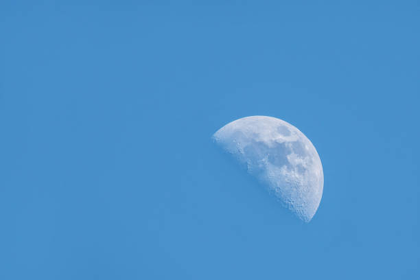 istock moon in blue sky during the day 686273800