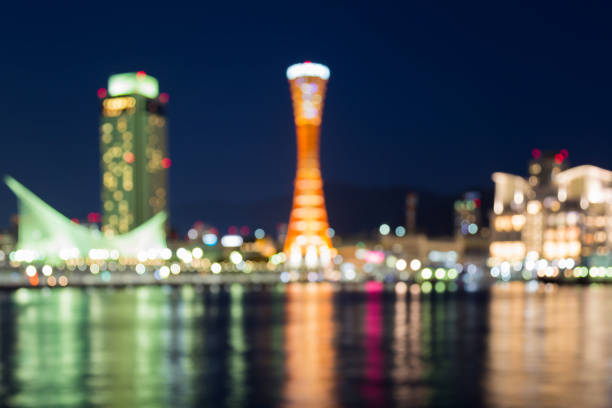 Abstract blurred twilight night view, Kobe port tower with water reflection, abstract background, Japan