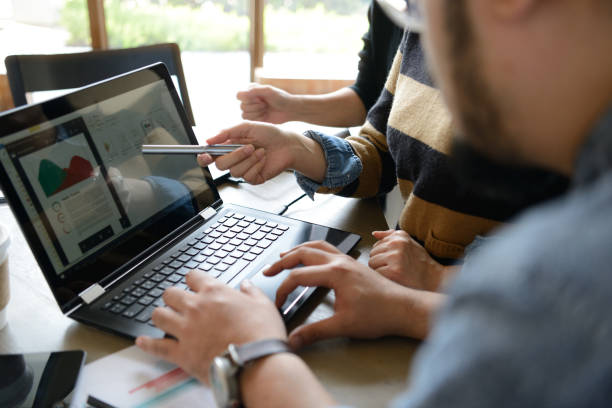 istock Business people working with digital tablet and laptop computer in coffee shop 686274516