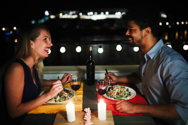 istock Beautiful couple in love having romantic dinner at night 686275344