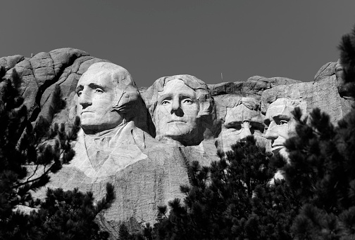 The iconic Mount Rushmore National Monument depicting US Presidents George Washington, Thomas Jefferson, Theodore Roosevelt, and Abraham Lincoln, carved out of the Black Hills Mountains outside of Rapid City, South Dakota.